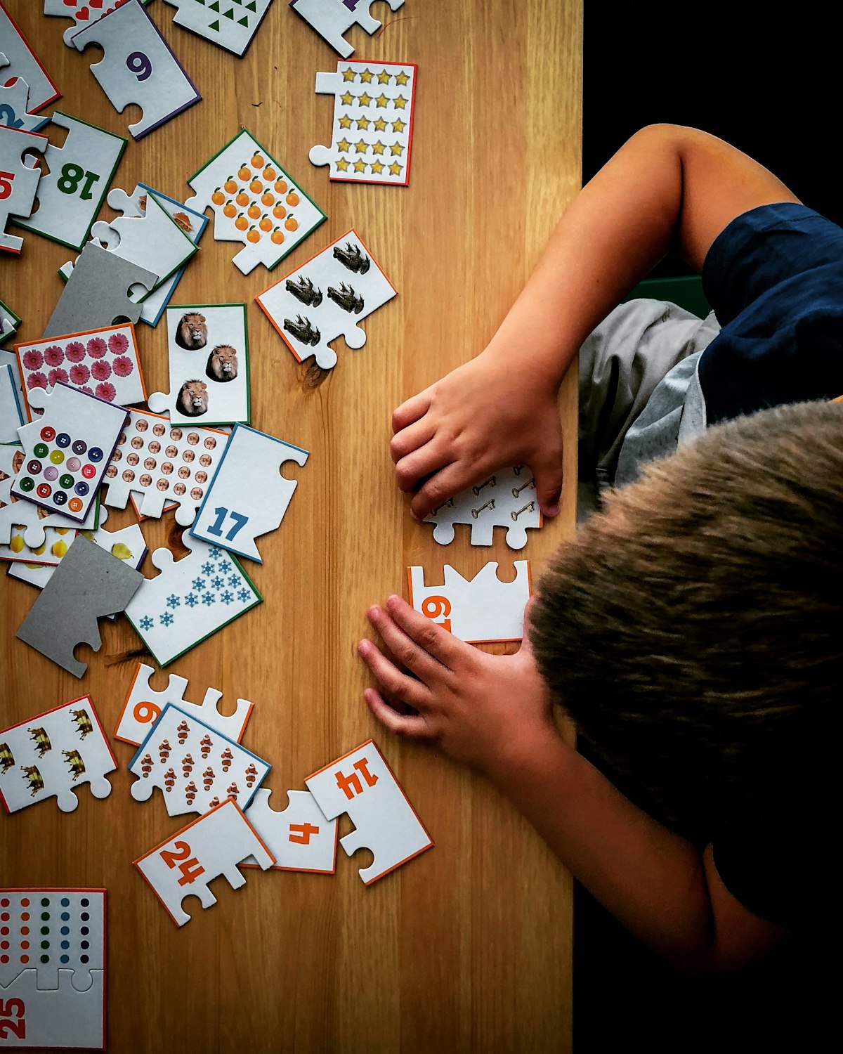 A child putting together a jigsaw puzzle